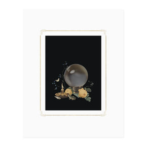 An unframed print of a crystal ball with candles and flowers on a black background.