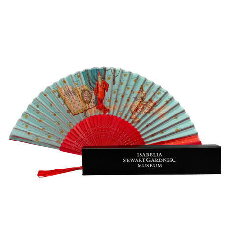 A fortune teller folding fan with a red design when closed, opened to show detailed illustrations. It is displayed next to its black gift box with the museum's name embossed in silver.